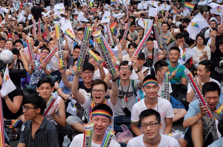 Same-sex activists celebrate outside of the parliament in Taipei yesterday, as Taiwan became the first place in Asia to legalise gay marriage (photo by Sam Yeh | AFP)